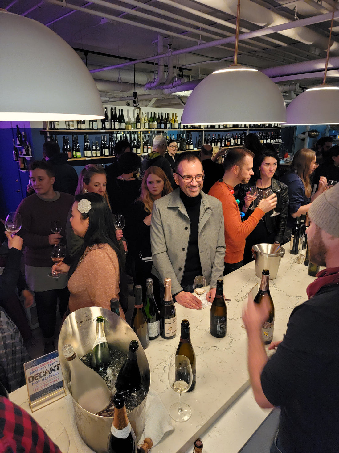 People tasting wine. People mingling and networking while sipping wines in Decant SF, San Francisco