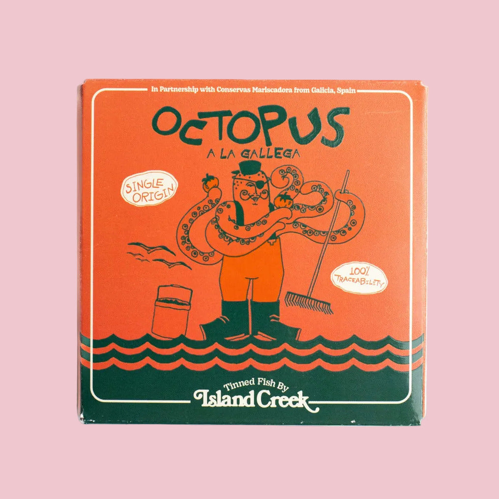 Box of Octopus a la Gallega from Island Creek on an pink background